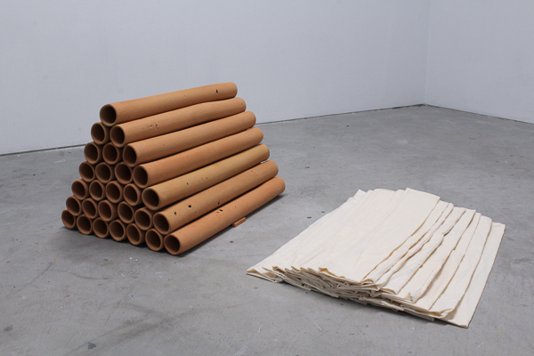 Stacked Tubes by Ebitenyefa Baralaye, stoneware, muslin