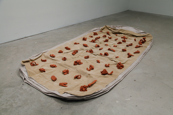 Guest Bed by Ebitenyefa Baralaye, clay, air mattress